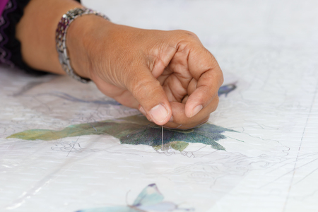 The hand craft of woman embroidered pictures with needle and thread.の写真素材