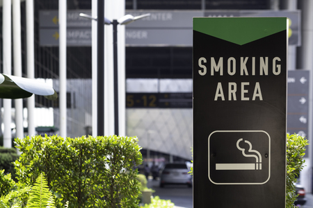 Smoking area sign outside the building.の写真素材