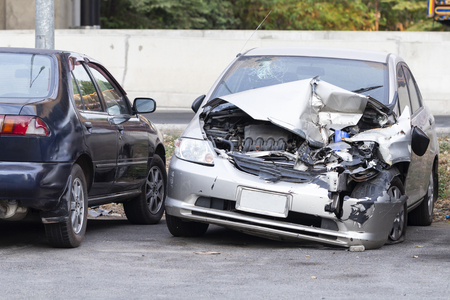 Front of silver car get damaged by accident on the roadの写真素材