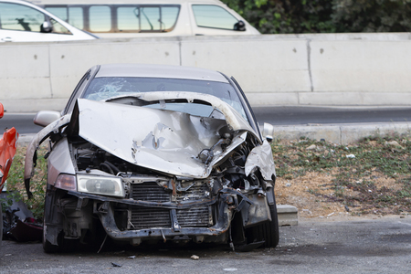 Front of silver car get damaged by accident on the roadの写真素材