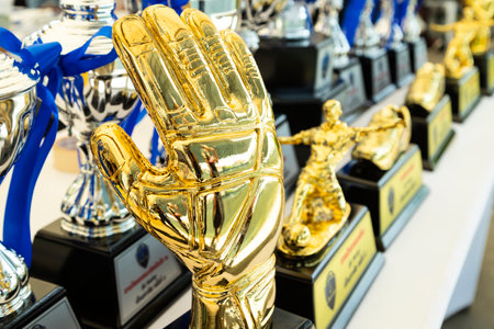 Golden simulation gloves for the best goalkeeper in the football or soccer match.のeditorial素材