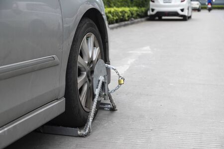 The car is locked wheels due to parking in a prohibited place.の写真素材