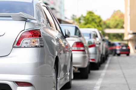 Car parking in line and car running background.の写真素材