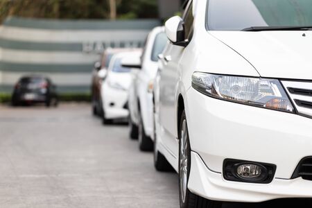 Car parked neatly inside an outdoor parking lot.の写真素材