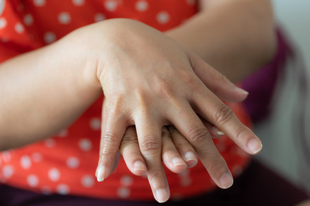 Close-up woman washing hands with alcohol gel to prevent infection corona virus covid-19.