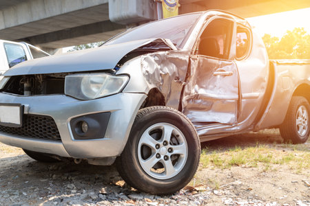 Close-up front of Silver car get damaged by accident on the road. concept of road safety.の写真素材