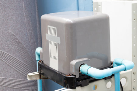 Home automatic water pump with blue pipeline.