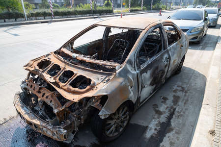 Burnt new car, on the side road.の写真素材