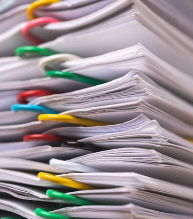 Close-up of Stack of Group report papers Document clipped in color clips, business, and education concept.の写真素材