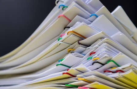 Close-up Stack of group report papers document clipped in color clips, business, and education concept.の写真素材