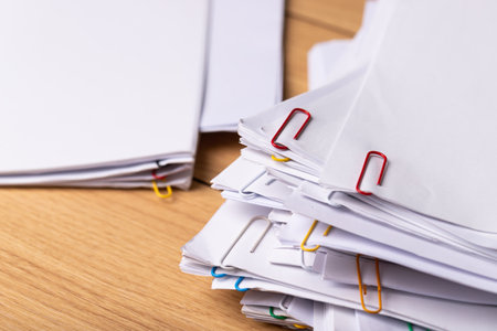 Close-up of Stack of Group report papers Document clipped in color clips, business, and education concept.の写真素材