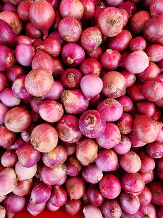 Closeup of fresh onions for sale from an local vegetable market.の写真素材