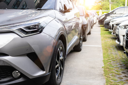 Parking of cars near the sidewalk for pedestrians, the cars stand in row on Parking.の写真素材