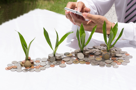 Save money with stack money coin for growing your businessの写真素材