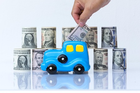 car model on dollar cash stack in  closeup concept  bussibess carの写真素材