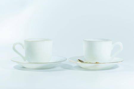 Empty White Cup on White Backgroundの写真素材