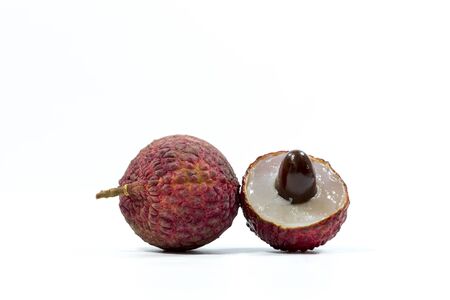 vegetarian, Fresh fruit lychee in the shell with half and leaves on white backgroundの写真素材
