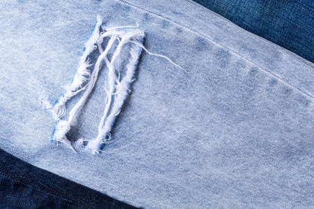 Blue denim fabric to stitch close-up in shop and supermarket.