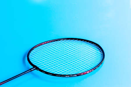 Badminton racket and shuttlecock on blue.の写真素材