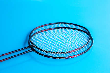 Badminton racket and shuttlecock on blue.の写真素材