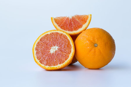 fresh yellow navel oranges on white background.