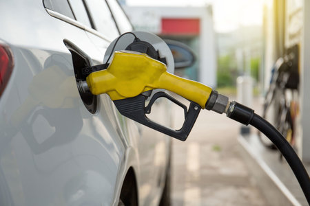Pumping gasoline fuel in car at gas station.concept Travel,price oil,industrail business and...