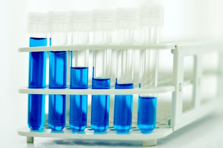 Test tubes with colored reagentの写真素材
