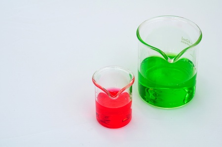 A two beakers with red and green solution の写真素材