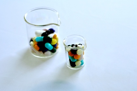 A colorful pills in the beakerの写真素材