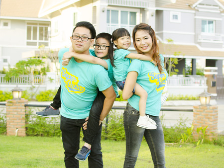 Asian family play together in the gardenの写真素材