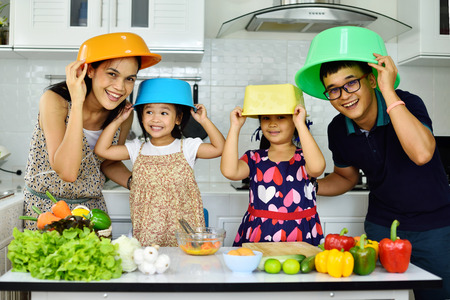 Happy family in kitchen roomの写真素材