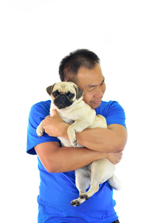 Portrait of Asian male with his dog on white backgroundの写真素材