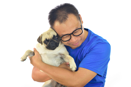 Portrait of Asian male with his dog on white backgroundの写真素材