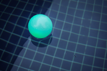 blue ball in swimming poolの写真素材