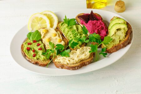 Different kinds of dips bread with humusの写真素材