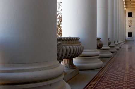 Hallway with ornate ceiling, floor, and pillarsの写真素材