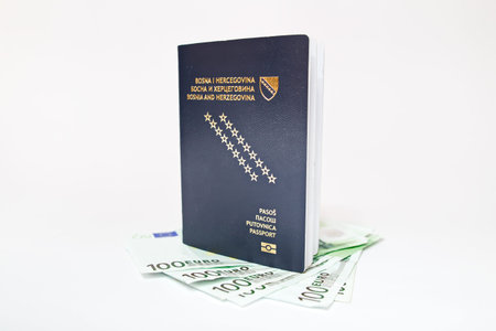 Bosnian passport and money on white backgroundの写真素材