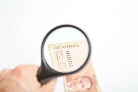 Magnifying Glass on the Colombian Pesos.の写真素材