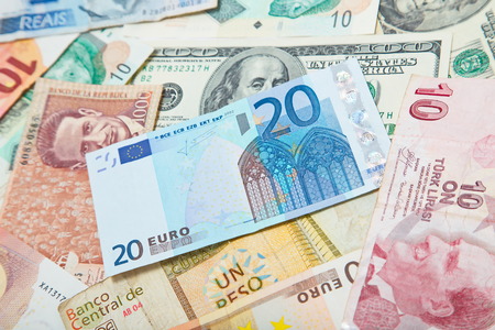 Background from paper money of the different countries. European euro in the middleの写真素材