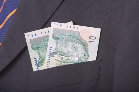 South african Rands in the pocket of a suitの写真素材