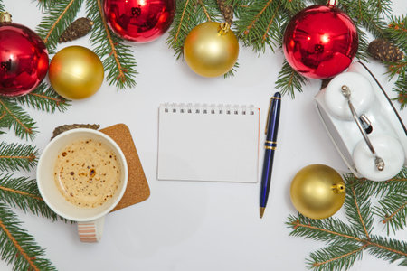 Blank notebook page with Christmas decoration with clock and coffeeの写真素材