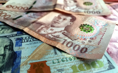 1000 Thai Baht and American Dollars banknotes