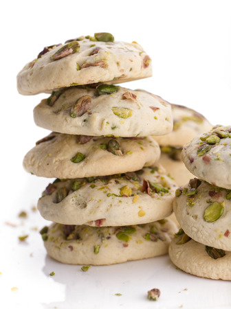 Cookies with pistachios and butter on a plateの写真素材