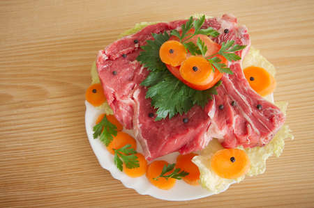 Pork meat decorated with vegetablesの写真素材
