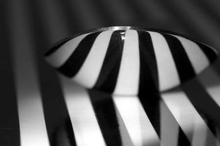 Macro of teaspoon with stripped reflectionの写真素材