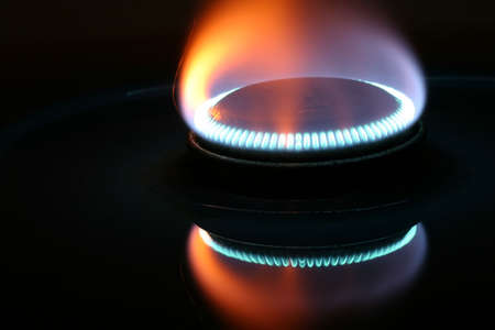 Red and blue gass flame with reflectionの写真素材