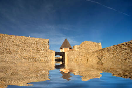 Chapel and walls on Medvedgrad castle with reflection in waterの写真素材