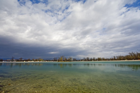 Lake with stormy clouds and reflection