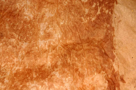 Aged paper with burned marksの写真素材