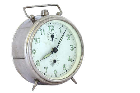 Old alarm clock isolated on whiteの写真素材